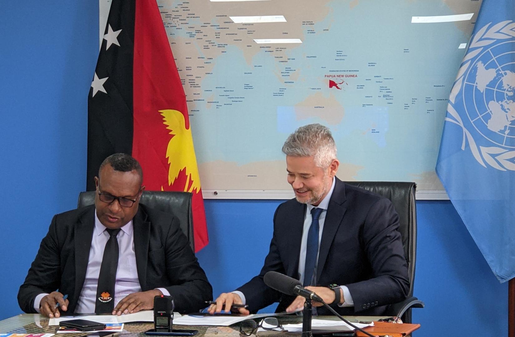 Signing of the UNSDCF 2024-2028 by DNPM Secretary Koney Samuel and UN Resident Coordinator, Richard Howard