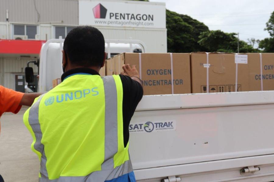 Man with boxes loaded into truck.